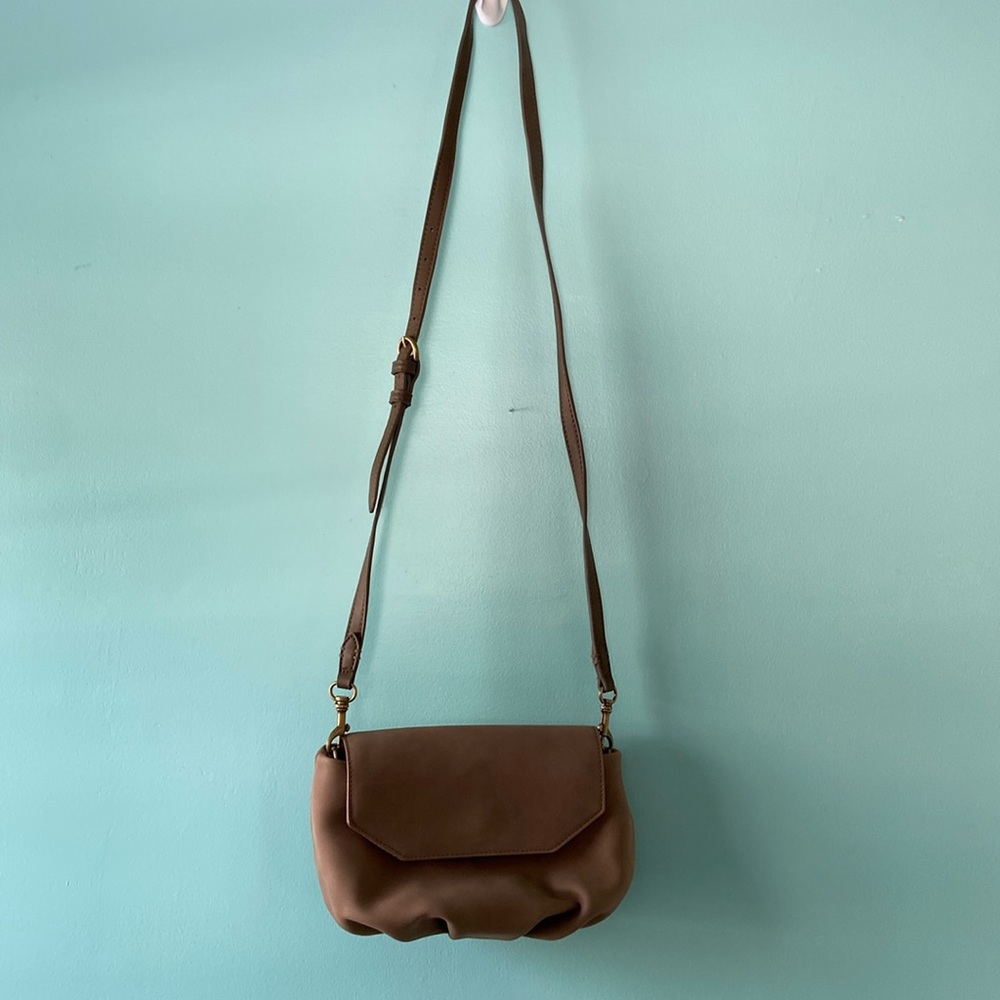 Taupe crossbody bag. Fits phone, keys, small wallet. Button closure